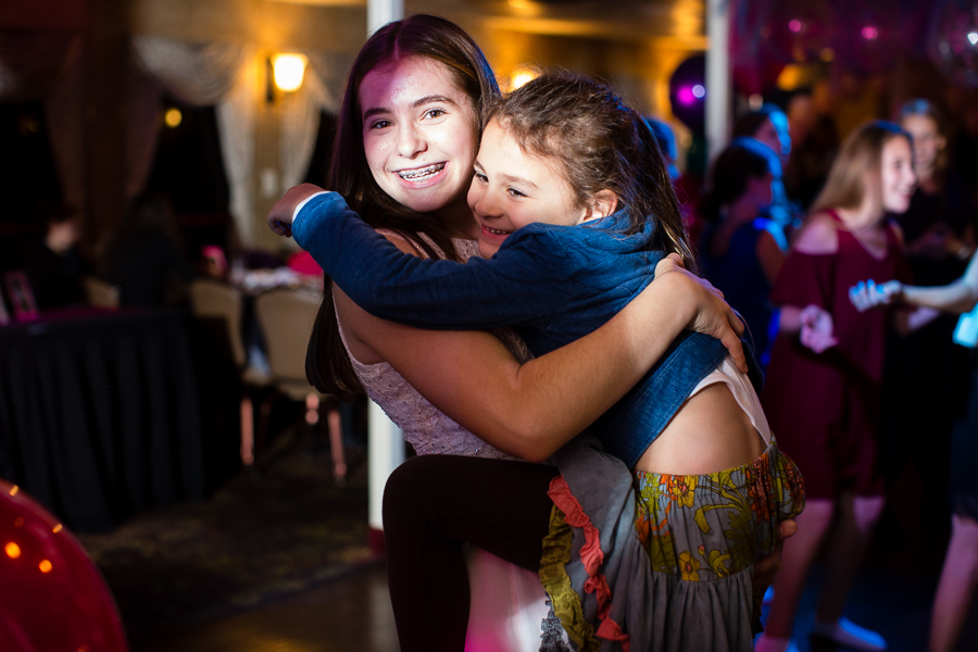 Girls Hugging at Bat Mitzvah Party