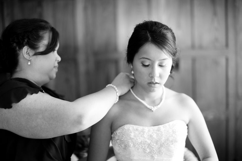Christina Montemurro Wedding Portfolio - mom puts necklace on bride