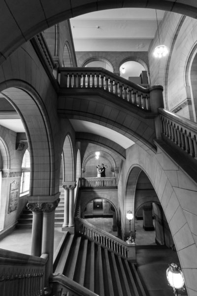 Bride and Groom in Beautiful Stone Architecture with Staircases in Pittsburgh Courthouse