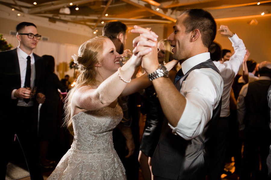Bride and Groom Dancing together at Reception with Move Makers Band