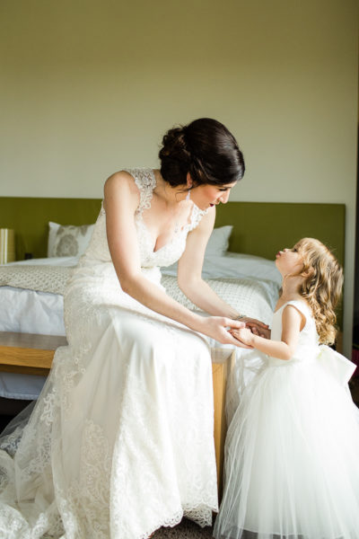 Classic moment of Bride with Flower Girl
