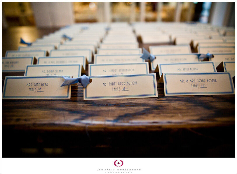 wedding place cards with blue type and ribbon