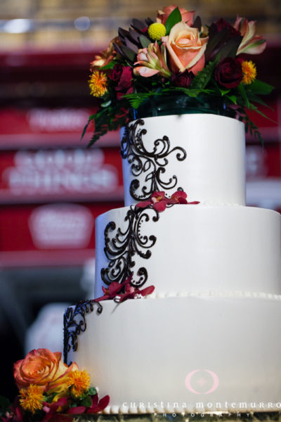 Pittsburgh Heinz History Center Wedding Cake with Ornate Icing and Floral Cake Topper