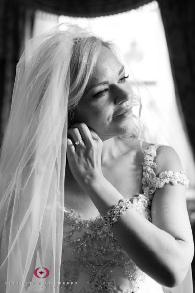 Bride puts on jewelry Omni William Penn Hotel Pittsburgh Wedding Photography