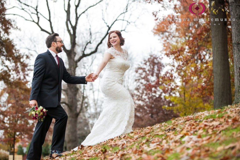 Bride and Groom walking with fall leaves