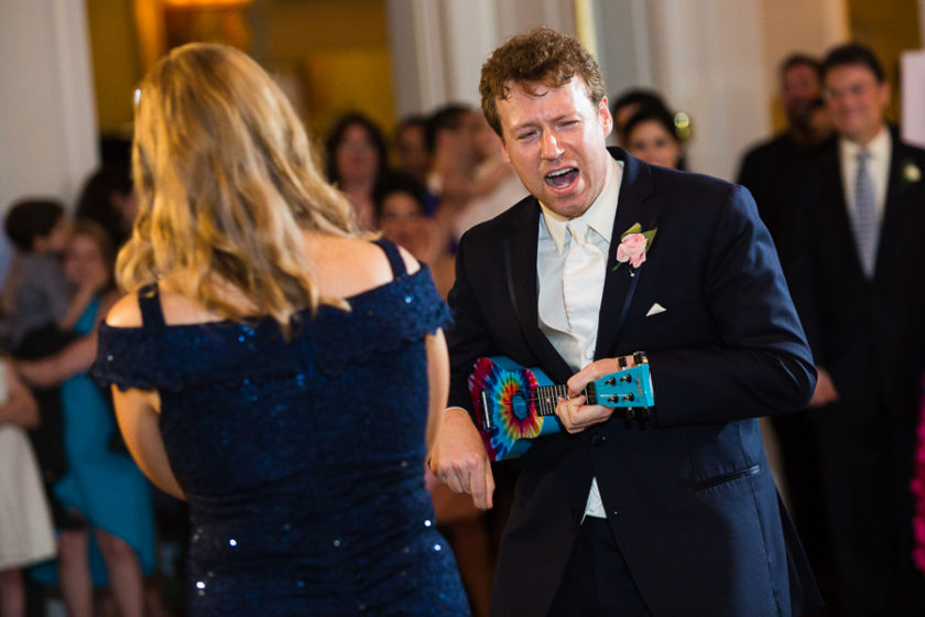 Groom plays a tie dye ukelele and sings to his mother