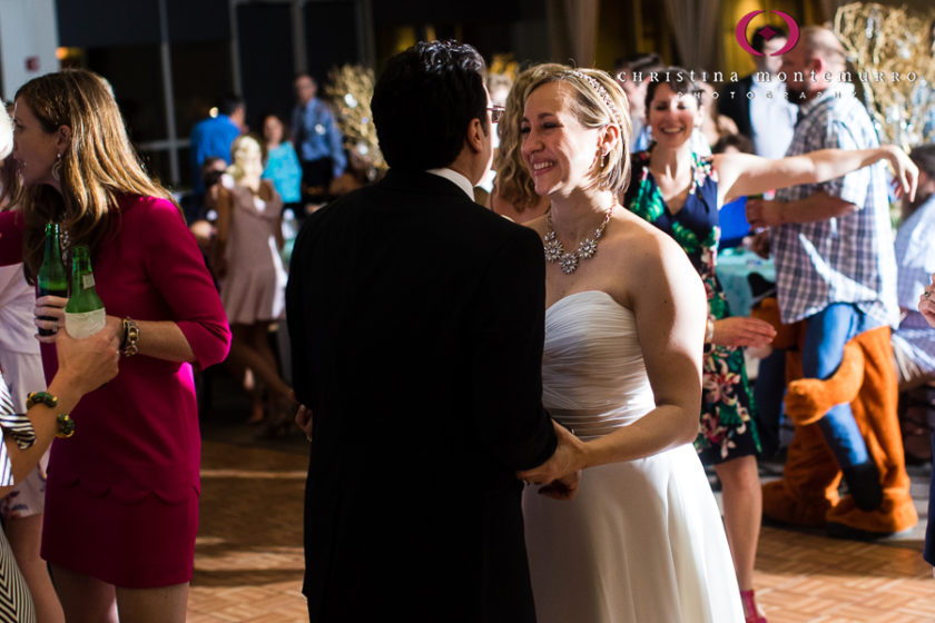 Happy bride and groom dancing at their wedding reception at the Heinz History Center Mueller Center