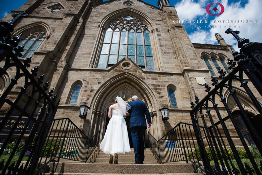 Bride and her father walking into the church for her wedding atSaint Peter Parish Pittsburgh