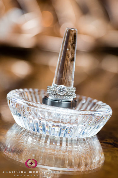 Beautiful diamond engagement ring and wedding bands in an heirloom glass dish