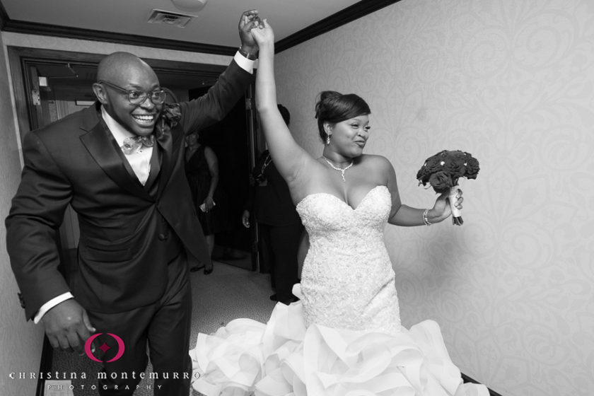 Bride and groom entering reception at Bob and Delores Hope Room Omni William Penn