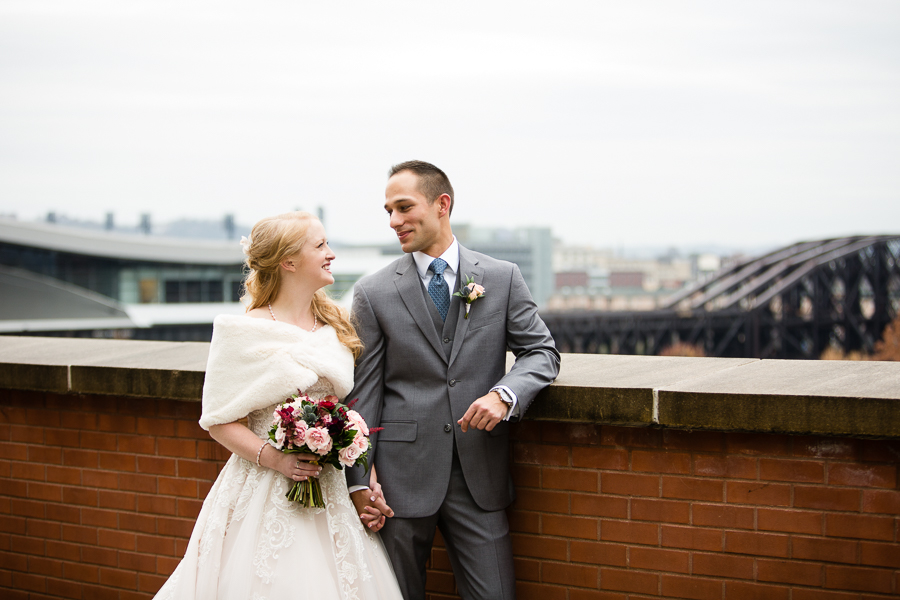 Bride with White Fur Wrap and Groom in Gray Suit on Heinz History Center Balcony