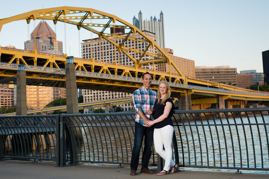 Engagement Photos Couple Walking on the North Shore by Fort Duquesne Bridge