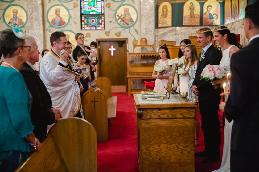 Bride and Groom Circle the Altar at Greek Orthodox Wedding