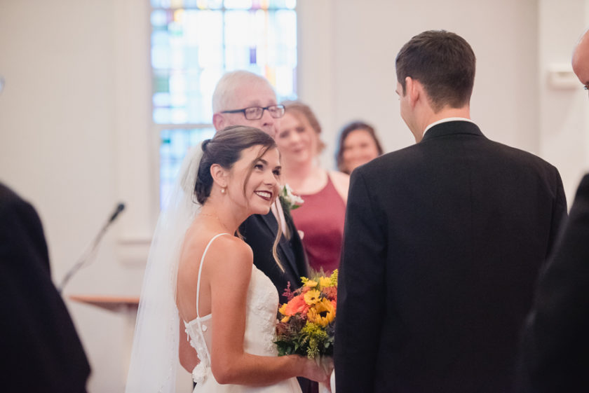 Bride Smiling at Groom at Wedding Ceremony
