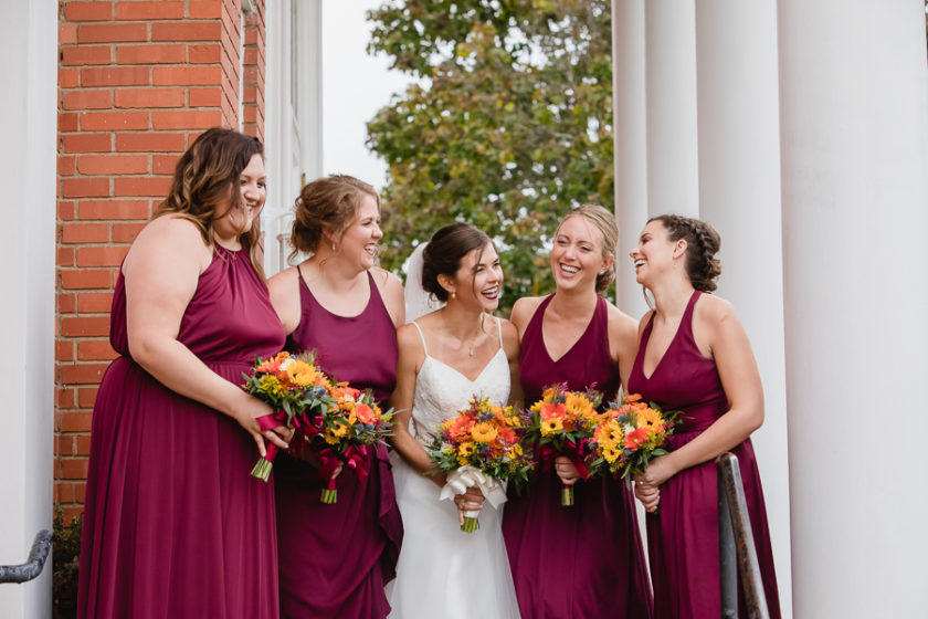 Bride and Bridesmaids in Burgundy Dresses with Colorful Fall Bouquets