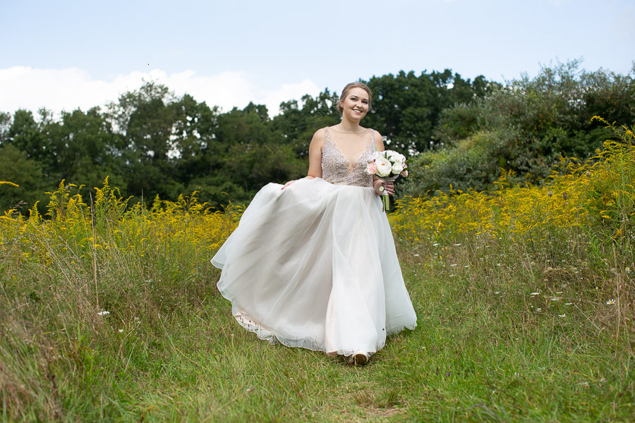 Bride in a field of yellow wildflowers