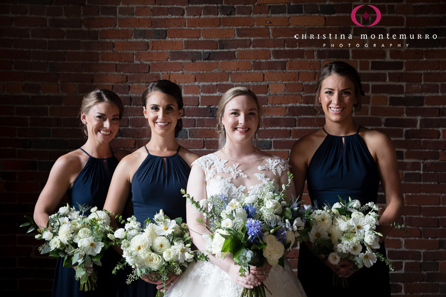 Bride and Bridesmaids with Low Updos, Bridesmaids in Navy Blue Dresses with Farmers Daughter Bouquets