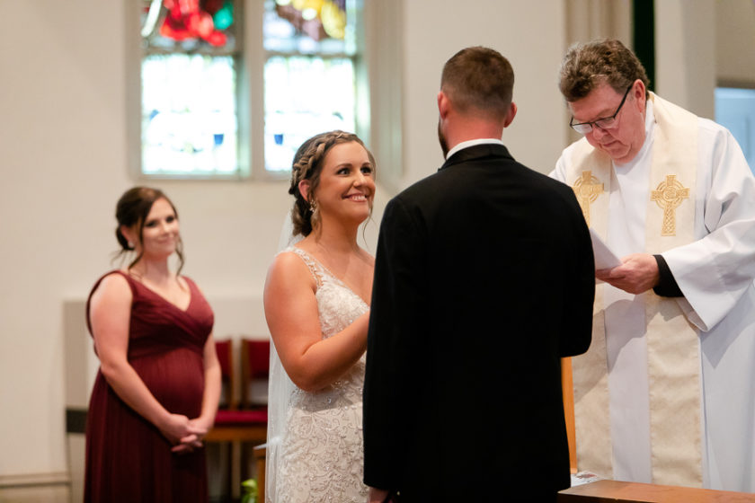Bride and groom exchange wedding vows Duquesne University Chapel Pittsburgh