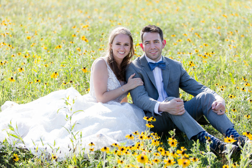 Bride and groom in field of black-eyed-Susans at North Park